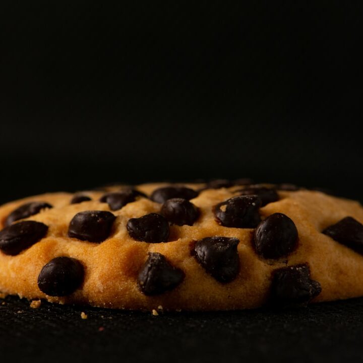 brown and black cookies on black surface