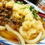 Udon noodles with beef and tempura in broth.
