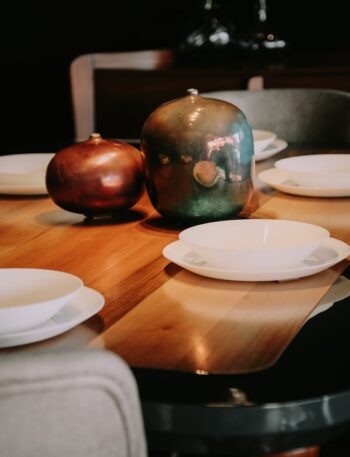 white ceramic plate on brown wooden table