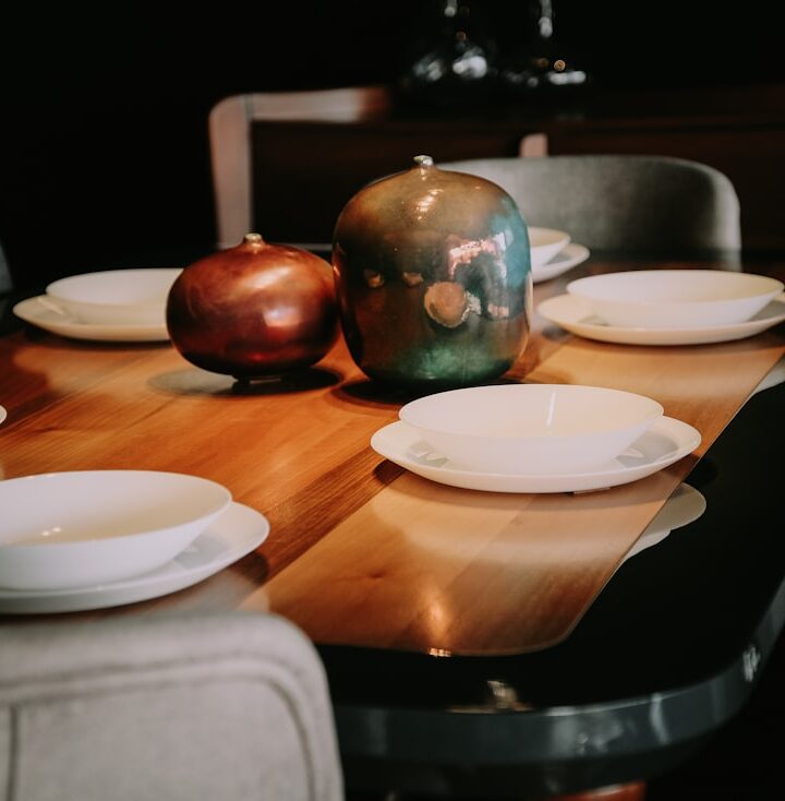 white ceramic plate on brown wooden table