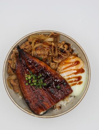 a white plate topped with meat and vegetables