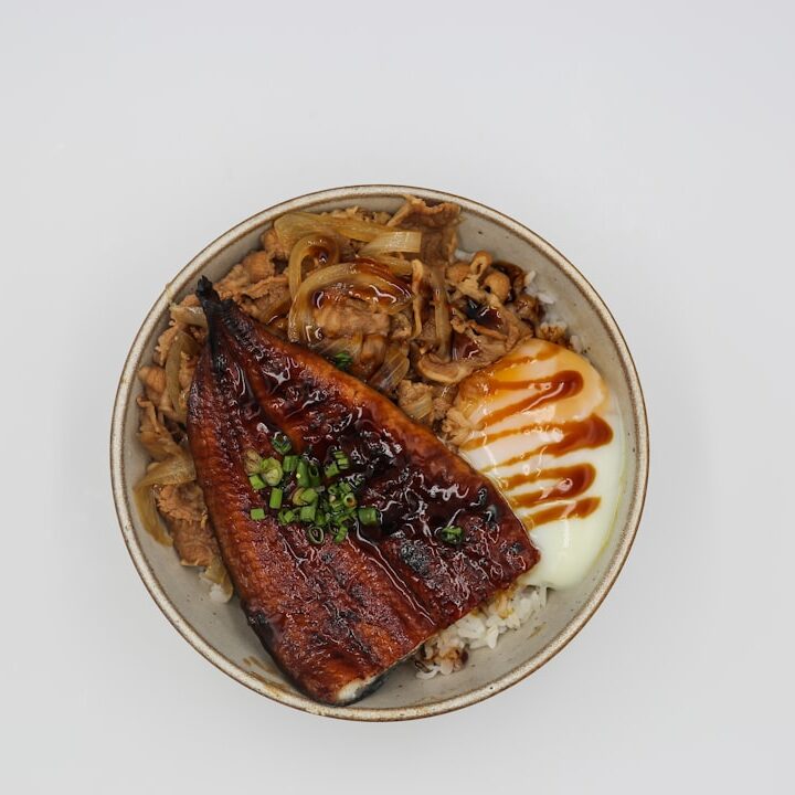 a white plate topped with meat and vegetables