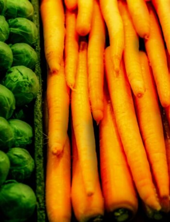 carrots and brussel sprouts are on display