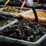 Various pickled vegetables and food in containers