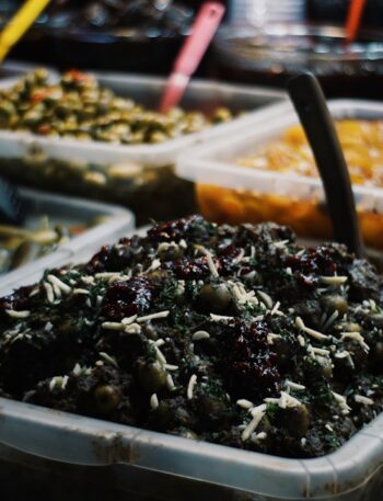 Various pickled vegetables and food in containers