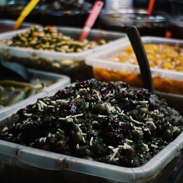 Various pickled vegetables and food in containers