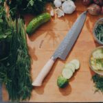 sliced cucumber and green vegetable on brown wooden table