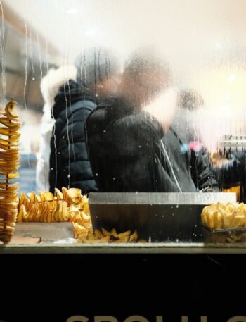 Fried potato spirals displayed at a food stall