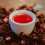 white ceramic cup with red liquid
