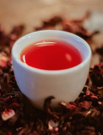 white ceramic cup with red liquid