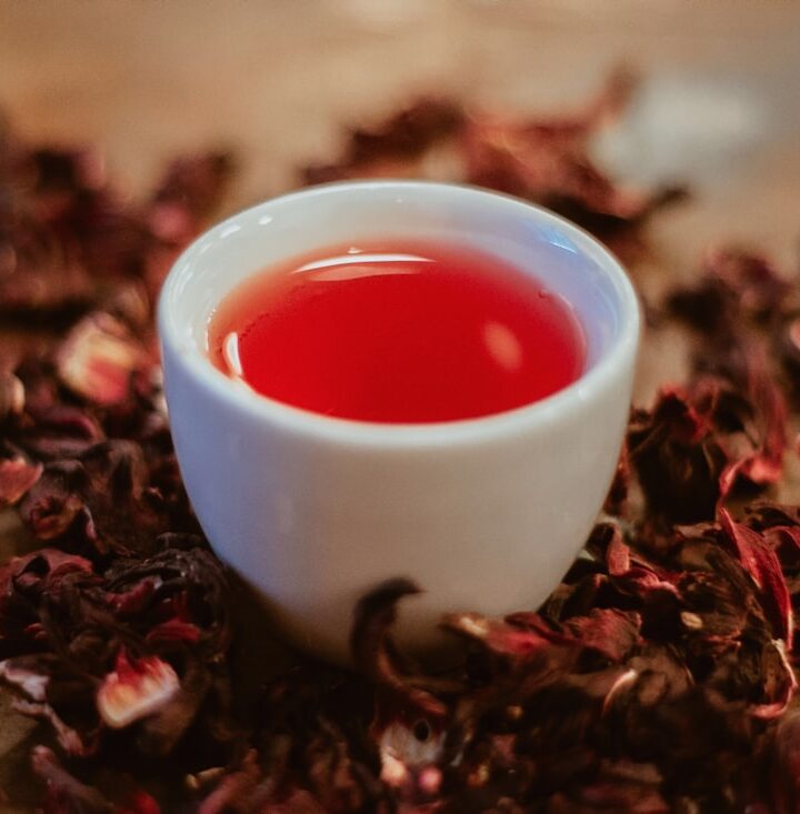 white ceramic cup with red liquid