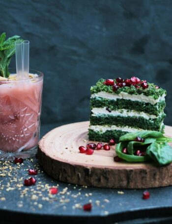 green and white cake slide on brown wooden plate