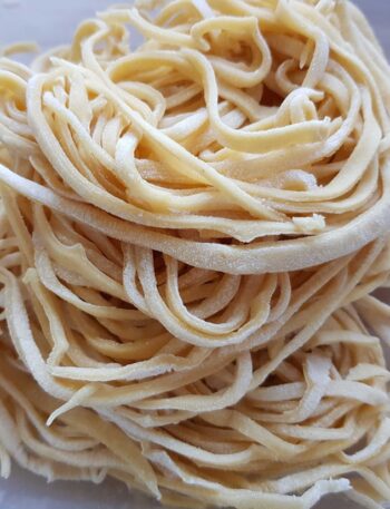 white pasta on white ceramic plate