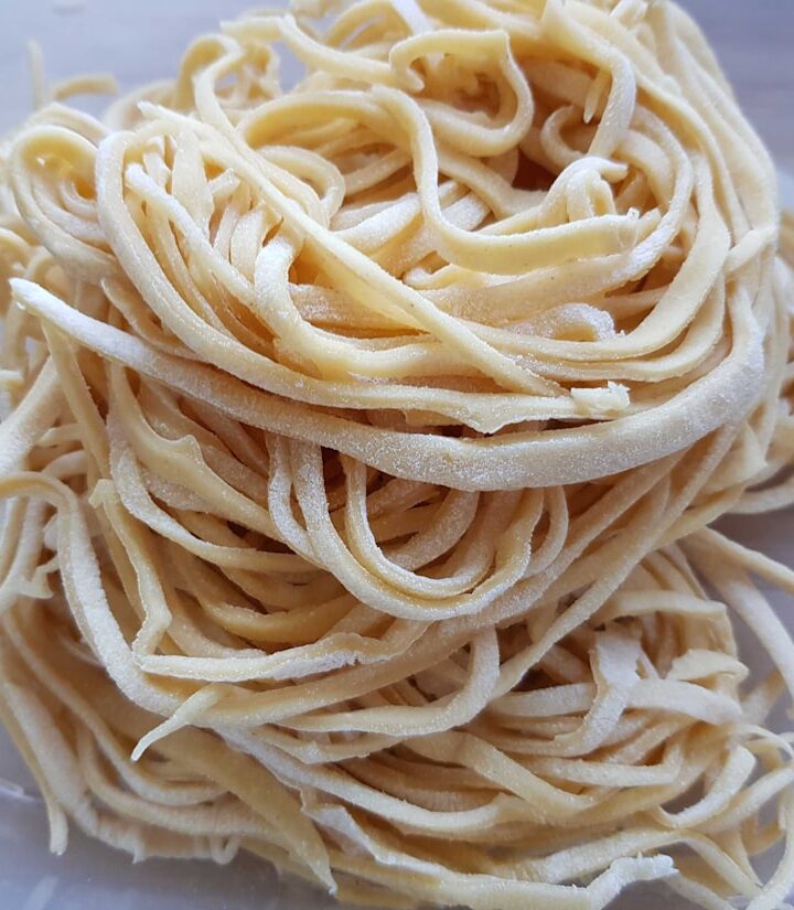 white pasta on white ceramic plate