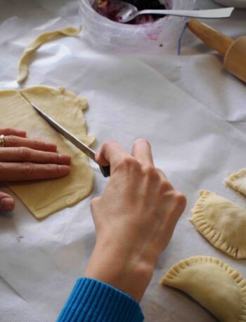 person making Empanadas