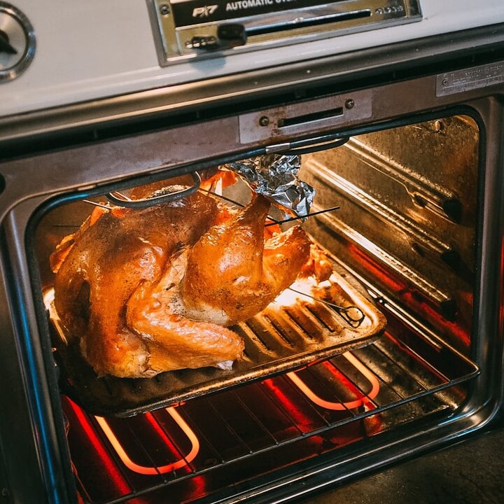 grilled chicken on black and silver grill