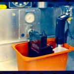 Sous vide machine in orange container