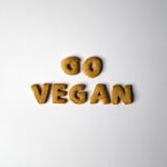 The word vegan spelled out with wooden letters