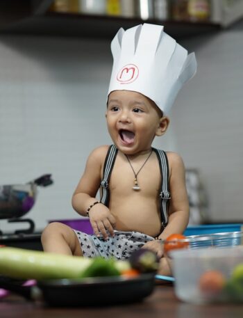 girl in black and white polka dot tank top eating