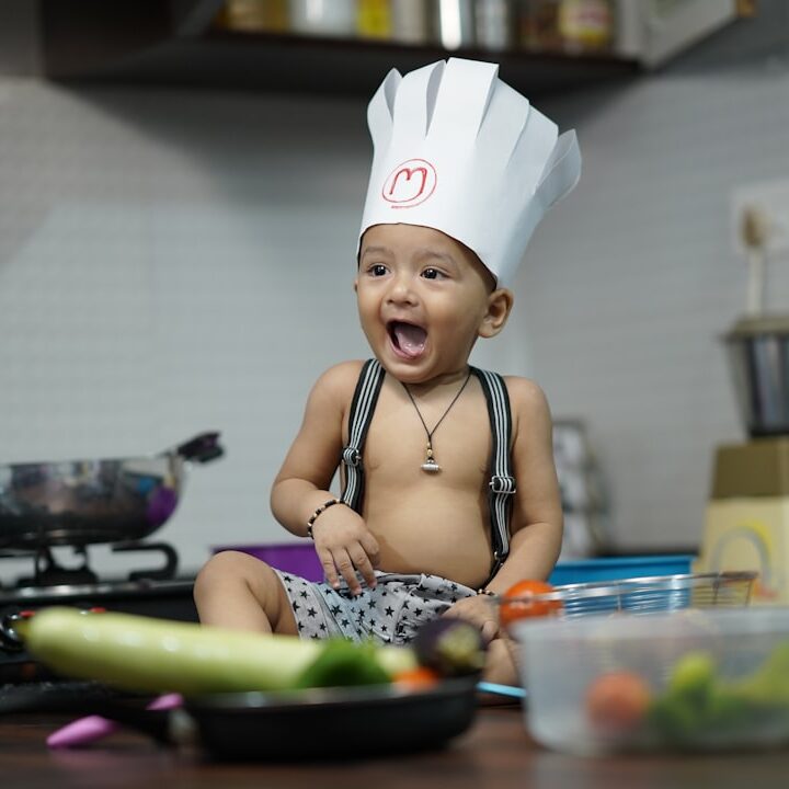 girl in black and white polka dot tank top eating