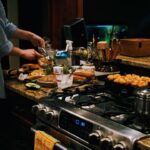 a person cooking food on a stove