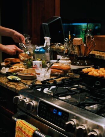 a person cooking food on a stove